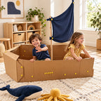 Two siblings playing in a cardboard pirate ship they built together